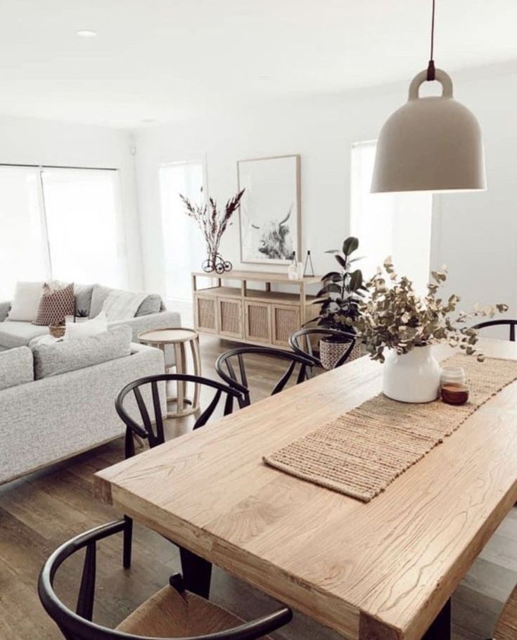 a wooden table sitting in the middle of a living room