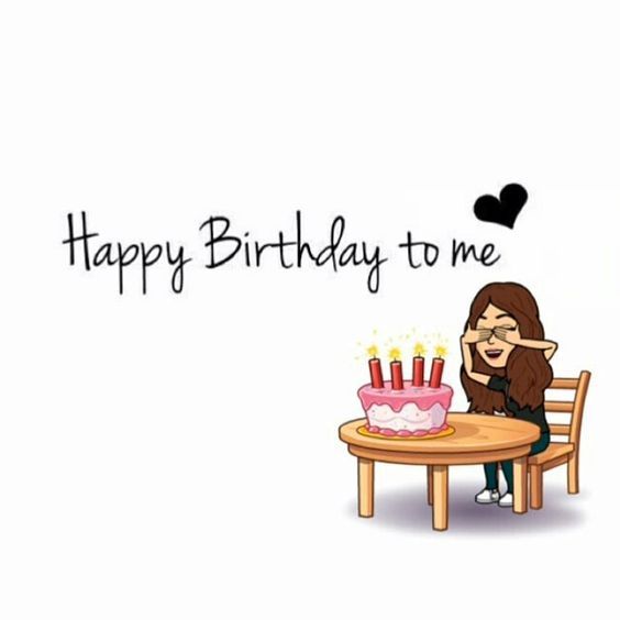 a woman sitting at a table with a birthday cake