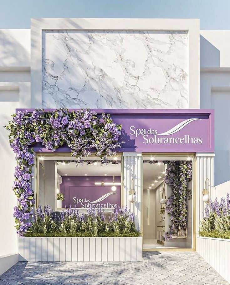 a store front with purple flowers on the outside