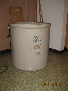 a white bucket with a face drawn on it