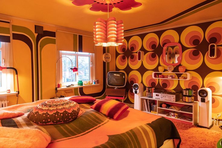 a bedroom decorated in bright colors and patterns