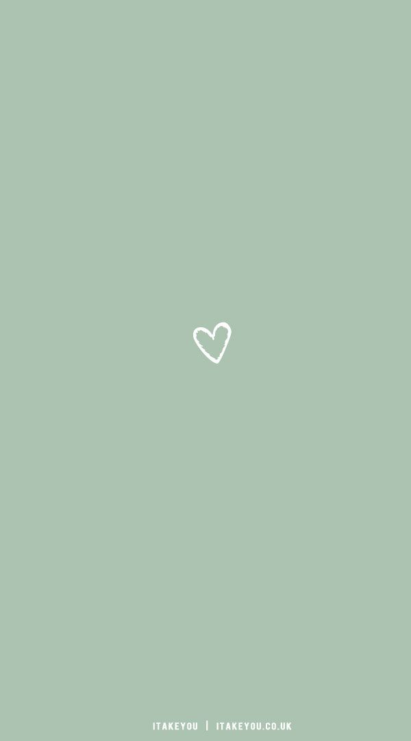 a white heart on a green background with the words, love is in the air