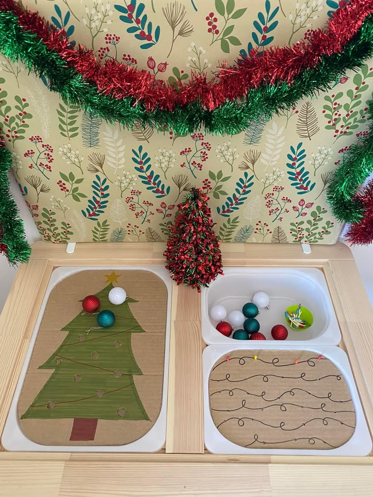 two trays with christmas decorations on them