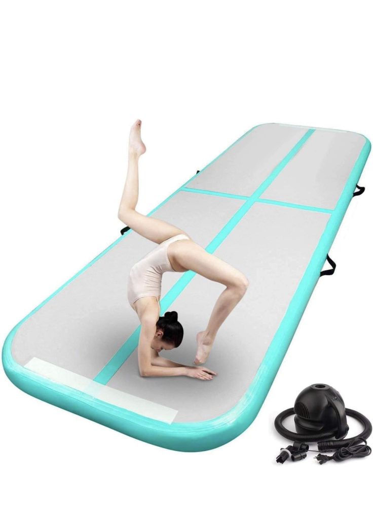 a woman is doing yoga on an inflatable mat