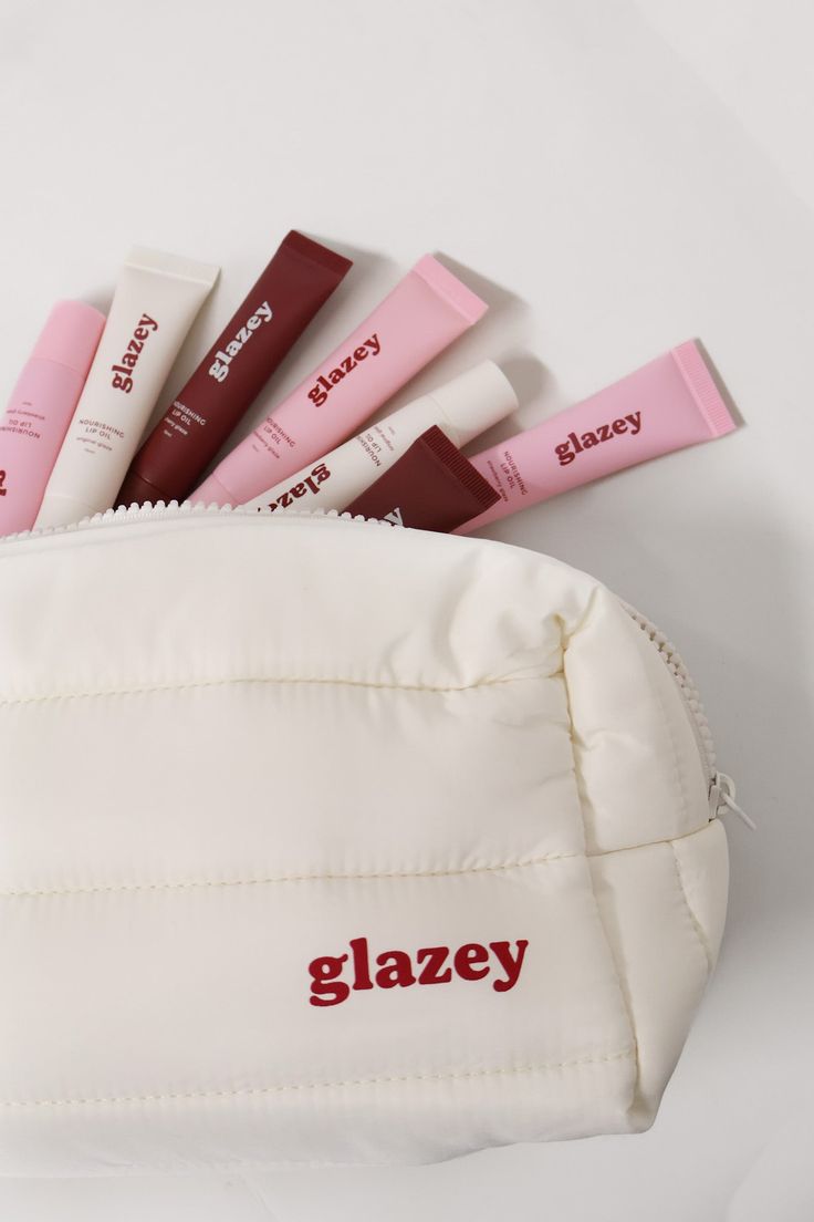 Where better to put all of your Glazey tubes than in a Glazey makeup bag? Whether you're on the go or just need an everyday makeup bag, you can't go wrong with this super cute addition. Why you'll love the Glazey makeup bag: She is super lightweight and the perfect size for all your everyday products Great for travelling, grab her and go! She made from a quilted puff material and is just all round super cute The details: Makeup bag Hook detail on the outside for hanging up or transporting Glazey logo on the front Zip closure across the top Quilted material that is super lightweight Lined Buffy Makeup, Bag Hook, Makeup Pouch, Everyday Makeup, Makeup Bag, The Details, The Go, Super Cute, Pouch