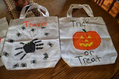 two trick or treat bags sitting on top of a table