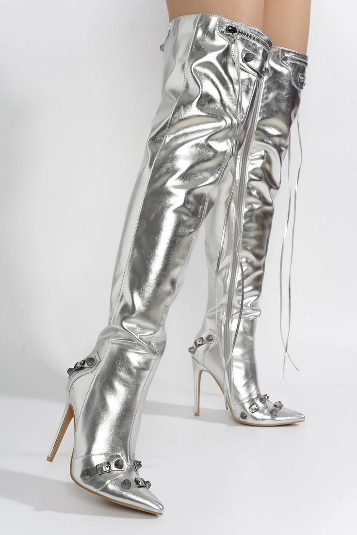 Put a little sass in your step with these stunning Pofin-2 thigh-high boots! A metallic finish gives them a touch of glam, while the stud and buckle trim and dangling lace zipper add a flirty flair. Comes in black and silver. pointy toe high heels thigh high boots stud and buckle trim metallic PU dangling lace zipper Metallic Thigh High Boots, Heels With Diamonds, Kpop Gg Outfits, Nicki Minaj Concert, Gg Outfits, Pointy Toe Boots, Boot Heels, Concert Outfit Inspo, Metallic Boots