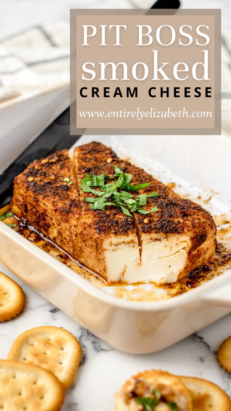 a white dish filled with cheese and crackers on top of a marble countertop