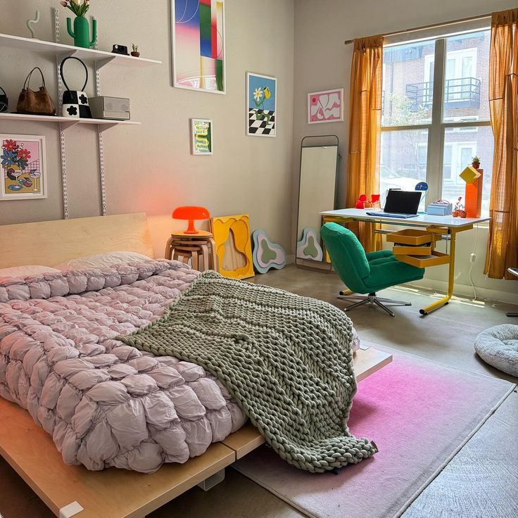 a bedroom with a bed and desk in it