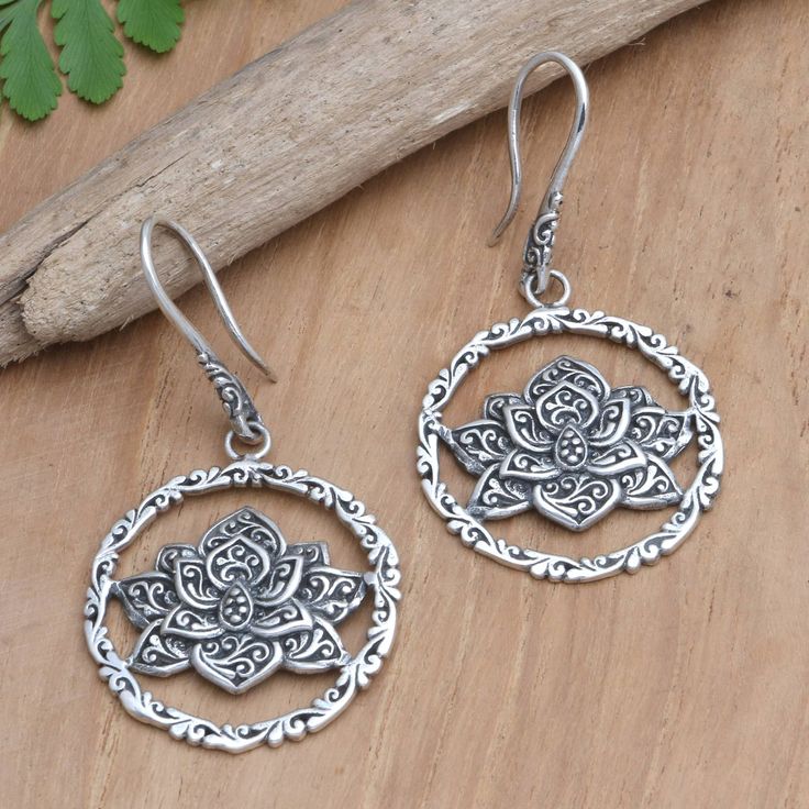 Indonesian artisan Rosalia Tarigan presents these sterling silver dangle earrings from her workshop in East Java, where she focuses on designing silver jewelry inspired by the rich silversmithing traditions of Bali and Java. With their floral lotus design, these earrings are perfect for the lively days of summer and a great gift for a loved one. Lotus Design, Silver Jewelry Design, Sterling Silver Dangle Earrings, Silver Earrings Dangle, Lotus, Crochet Earrings, Jewelry Earrings Dangle, Silver Jewelry, Dangle Earrings