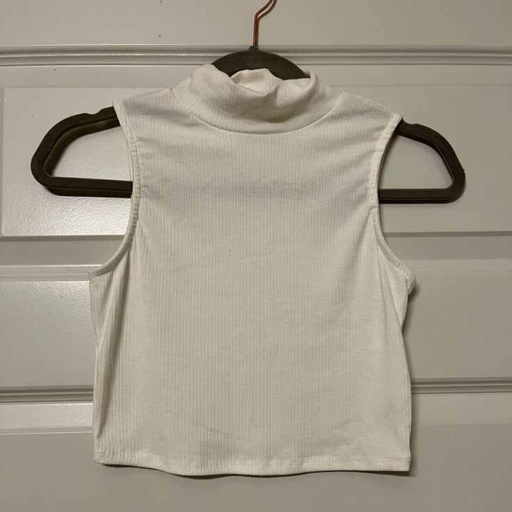 Bohme White Sleeveless Turtleneck; Size Small. Never Worn White Ribbed Halter Top For Spring, Summer White Ribbed Halter Top, White Ribbed Halter Top For Summer, Casual White Ribbed Vest, Trendy White Halter Tank Top, White High Neck Tank Top For Spring, White Fitted High Neck Tank Top, White Ribbed Crop Top Tank, White Ribbed Crop Top Tank Top