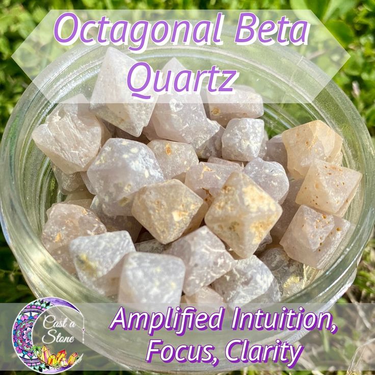 a glass bowl filled with lots of white cubes on top of green grass and the words, octagonal beta quartz