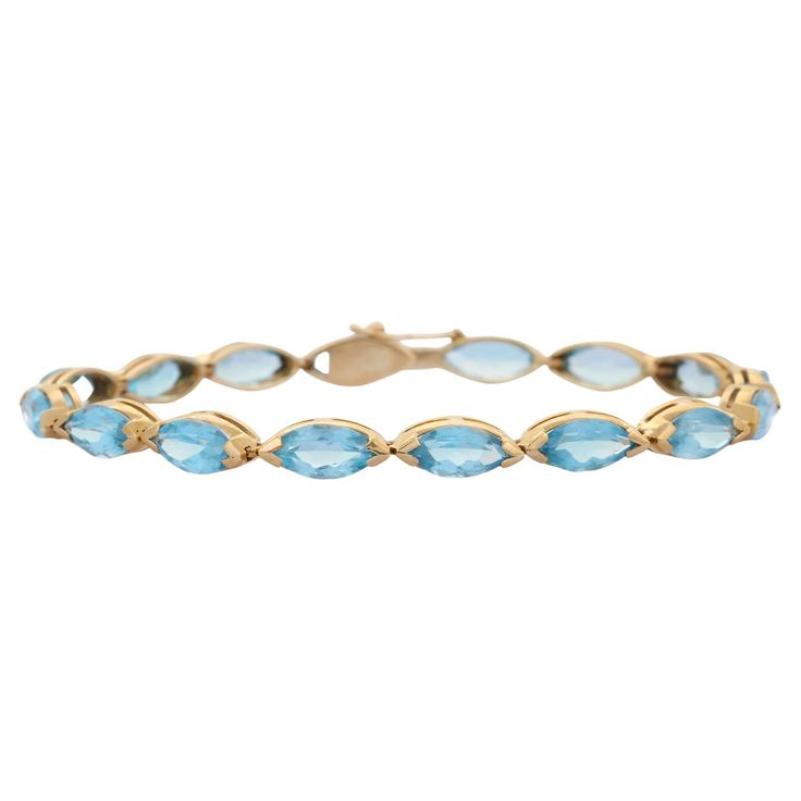 This Modern Marquise Blue Topaz Tennis Bracelet in 14K gold showcases 16 endlessly sparkling natural blue topaz, weighing 18.9 carats. It measures 8 inches long in length. Blue topaz helps to improve communication and self expression. Designed with perfect marquise cut blue topaz set horizontally in solid gold settings in repetition making a beautiful bracelet to make you stand out on any occasion or event. The elegant style complements the attire beautifully and this is a perfect Unique Gift, B Slide Bracelet Charms, Topaz Yellow, Slide Bracelet, Blue Topaz Bracelet, Gold Topaz, Modern Bracelets, Mother Daughter Gifts, Blue Topaz Stone, Improve Communication