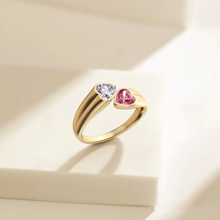 Unveiling the 'Hearts As One' Toi Et Moi Promise Ring, a masterful expression of love's enduring bond. This ring captures the essence of companionship with two heart-shaped stones, a clear white and a soft pink, set intimately side by side. Their luminous colors shine against the polished band, a symbol of enduring partnership and shared dreams. Celebrating 'Toi Et Moi,' French for 'you and me,' it reflects a perfect union of unique individuals coming together in harmony. This piece isn't merely Cubic Zirconia Heart Ring For Mother's Day Promise, Promise Heart Ring With Birthstone, Heart Ring With Birthstone For Promise, Heart Birthstone Promise Ring With Open Design, Open Heart Ring With Birthstone For Promise, Valentine's Day Promise Diamond Ring With Birthstone, Gold Birthstone Ring For Valentine's Day Proposal, Fine Jewelry Heart Ring With Birthstone For Promise, Heart-shaped Birthstone Ring For Mother's Day