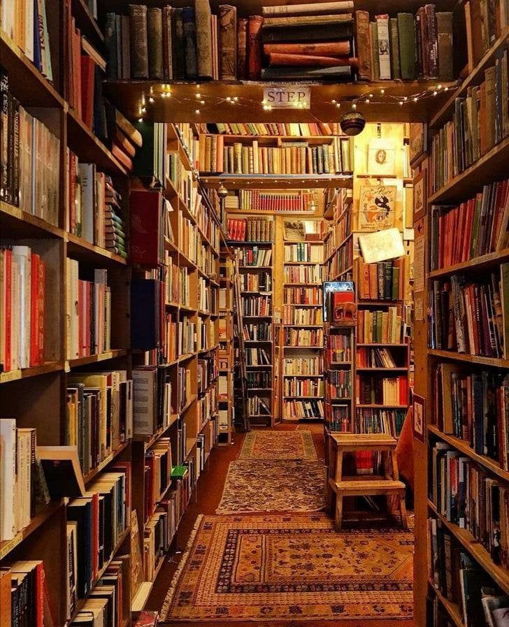 a long row of bookshelves filled with lots of books