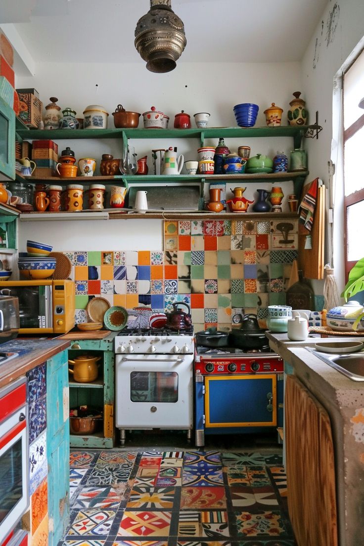 an old kitchen with colorful tiles on the walls and floor, including a stove top oven