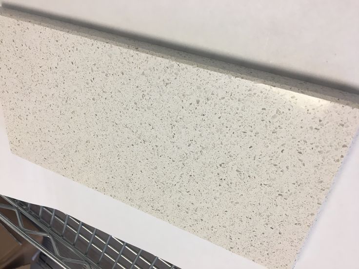 a close up view of the ceiling in a kitchen with white and gray speckles