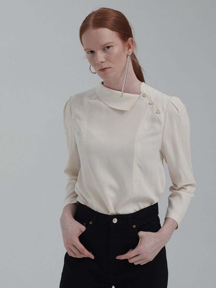 Editor's NotesUnique design asymmetrical detail collar puff sleeve design blouse top. This has a casual and classy mood that is great to style in a casual and formal way with various of outfits.- Unique detail pointed blouse top- Chic and feminine silhouette when worn- Natural drape like silhouette design wear- Great to style in various of luxurious waysMeasurements(in.)One Size (XS-M)- Total Length: 23.43 in.- Shoulder: 14.80 in.- Chest: 37.13 in.- Hem: 40.31& Office Blouse With Collared Blouson Sleeves, Collared Blouson Sleeve Blouse For Work, Workwear Blouse With Blouson Sleeves And Collar, Timeless Collared Tops For Office, Chic Collared Blouse With Blouson Sleeves, Timeless Spring Collared Blouse, Timeless Fitted Top For Office Wear, Timeless Formal Collared Blouse, Timeless Formal Blouse With Collar