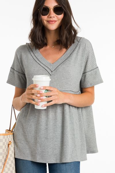 Waffle texture + a babydoll fit make this top a dream! It is easy and effortless, yet will have you looking so stylish. Raw edges and exposed seams add a cool, casual vibe, and the fabric is a soft and lightweight poly-rayon blend that offers plenty of stretch. *also offered in white* Chic Waffle Knit V-neck Top, Soft Knit V-neck Top, Solid V-neck Knit Top For Loungewear, Chic Waffle Knit Loungewear Top, Relaxed Soft Texture Top For Spring, Casual Spring Top With Soft Texture, Casual Spring Tops With Soft Texture, Summer Loungewear Solid Knit Top, Summer Lounge Knit Top