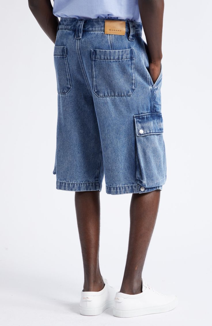 Well-faded denim made of lyocell and cotton furthers the easy comfort of Bermuda-length cargo shorts made with plenty of room to move or relax. 12 1/2" inseam; 22" leg opening; 13" front rise; 17" back rise (size 40) Zip fly with two-snap closure Front slant pockets; back patch pockets; cargo snap-flap bellows pockets 77% lyocell, 23% cotton Machine wash, dry flat Imported Designer Clothing Utility Style Medium Wash Jean Shorts, Utility Jean Shorts With Multiple Pockets, Utility Denim Shorts With Multiple Pockets, Spring Denim Cargo Shorts With Multiple Pockets, Denim Cargo Shorts With Multiple Pockets For Spring, Utility Denim Jean Shorts, Denim Blue Cargo Pocket Jean Shorts, Denim Blue Cargo Jean Shorts, Denim Blue Jean Shorts With Cargo Pockets