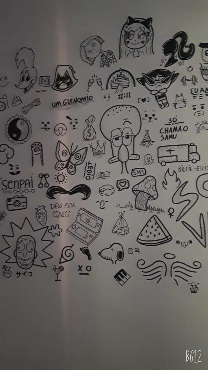 a bunch of doodles are drawn on the back of a refrigerator freezer door