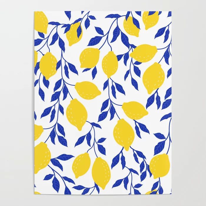 a blue and yellow towel with lemons on it, against a white wall background