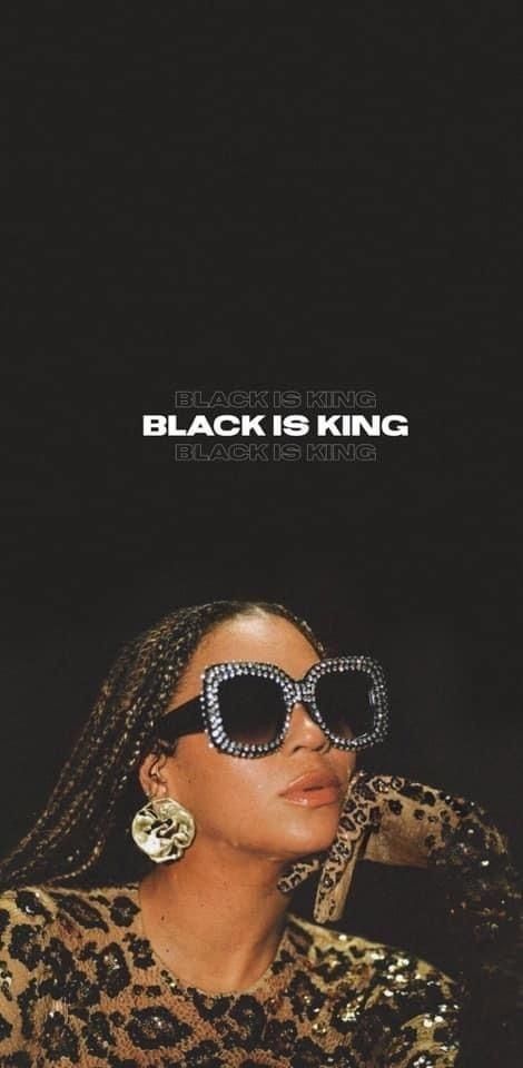 a woman wearing sunglasses with the words black is king in front of her face and leopard print