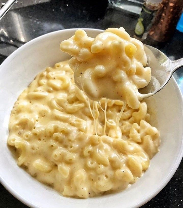 a white bowl filled with macaroni and cheese