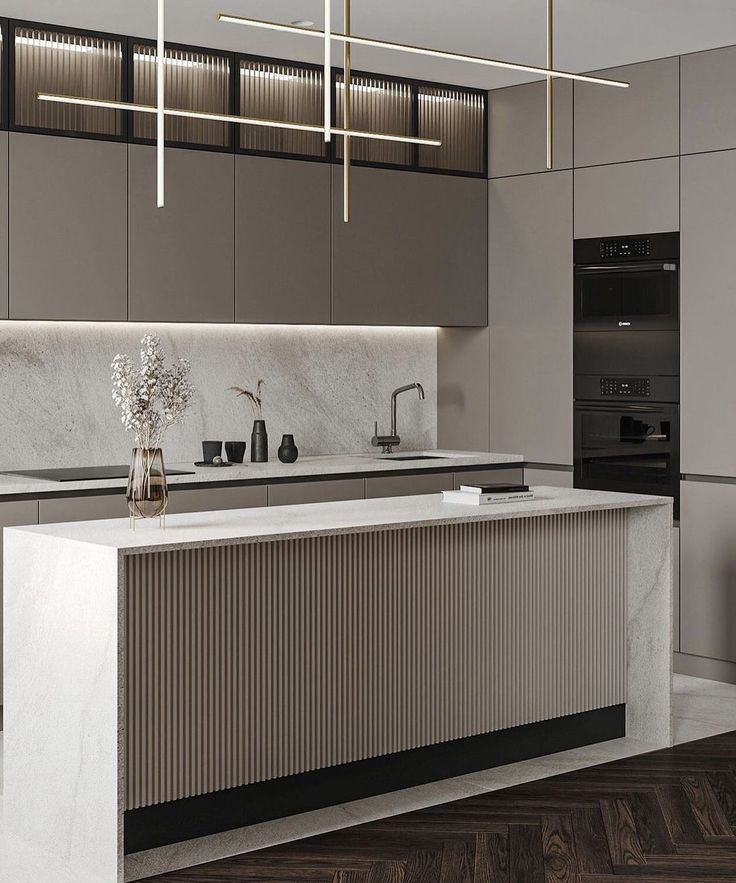 a modern kitchen with marble counter tops and stainless steel appliances