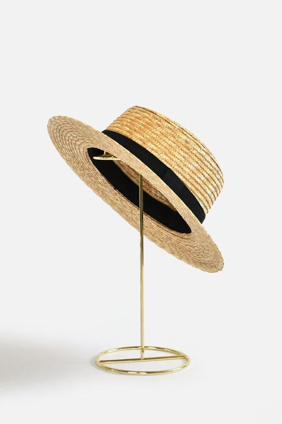 Bring classically chic flair to your summer look with the Abella Classic French Boater Hat. This classic French accessory is made from breathable straw and designed with an adjustable pull string for the perfect fit. You'll love the elegant aesthetic this piece adds to any ensemble.Head circumference: 55.5cm (designed with adjustable pull string for the perfect fit)Your purchase can also be made at:www.enbelleepoque.com Chic Spring Boater Hat Made Of Paper Straw, Summer Curved Brim Boater Hat For Picnic, Summer Picnic Boater Hat With Curved Brim, Adjustable Black Straw Hat Made Of Paper Straw, Classic Adjustable Hats For Spring, Classic Boater Hat With Curved Brim For Spring, Chic Beige Straw Hat For Garden Party, Classic Adjustable Hat For Spring, Spring Summer Boater Hat For Picnic