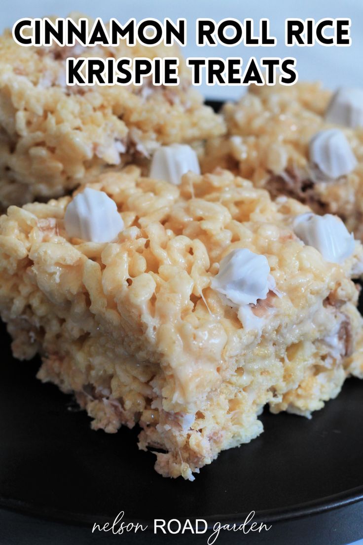 cinnamon roll rice krispie treats on a black plate