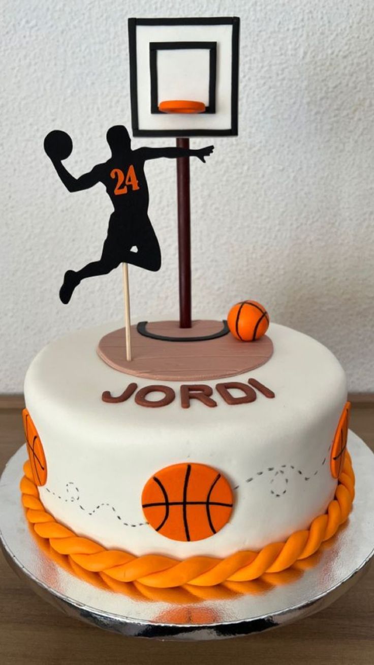 a birthday cake with a basketball and hoop on top