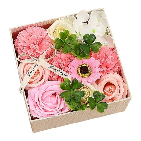 a box filled with lots of pink and white flowers