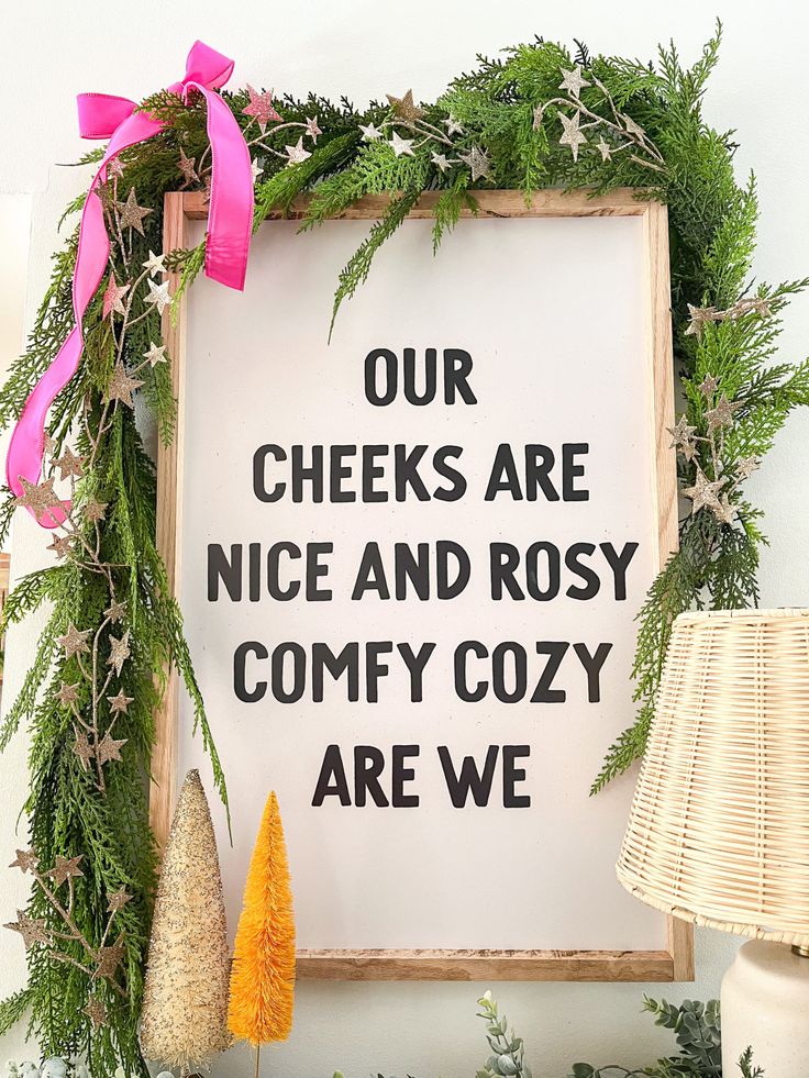 a sign that says our cheeks are nice and rosy comfy cozy are we