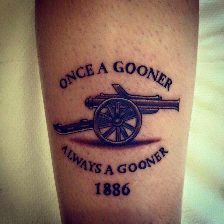 a tattoo that reads, once a gooner always a gooner 1876 on the leg