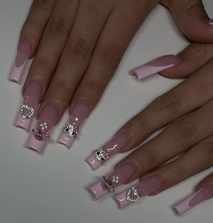 Pink Chrome French Tip Nails With Rhinestones, Curved French Tip Nails Square, Tapered Square Nails Hello Kitty, Long Square Nails With Charms, French Tip With Charms Y2k, Pink French Tip Nails With Cross Charm, French Tip Nails With Planet Charms, Pink French Tip Hello Kitty Nails, Crown Charm Nails