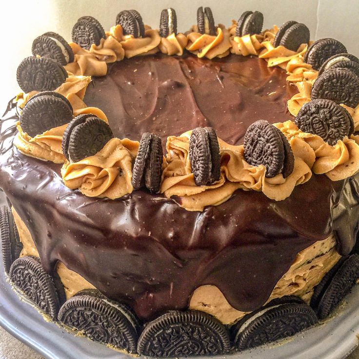 an oreo cookie cake with chocolate frosting and cookies on top