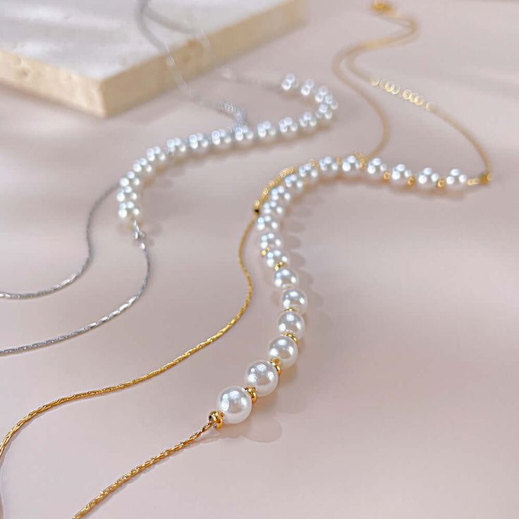 ✦ For a timeless and elegant look in your jewelry, try this Dainty Pearl Beads Layering Chain Necklace. Pairing double-layered pearls with delicate beads, this necklace is perfect for everyday wear and is resistant to tarnishing. Receive daily compliments with this minimal and refined necklace. ----------- DETAILS ----------- - Color: Gold/ Silver - Chain Length: 36.5cm + 6cm - Materials: Gold Plated, 316L Stainless Steel, Faux Pearl *316L Stainless Steel is hypoallergenic, generally safe for sensitive skin. - SKU: GX2309 Necklace Pairing, Layered Pearls, Basic Jewelry, Crystal Hoop Earrings, Nose Rings Hoop, Fashion Jewelry Earrings, Stylish Jewelry, Gemstone Bracelets, Gorgeous Necklaces