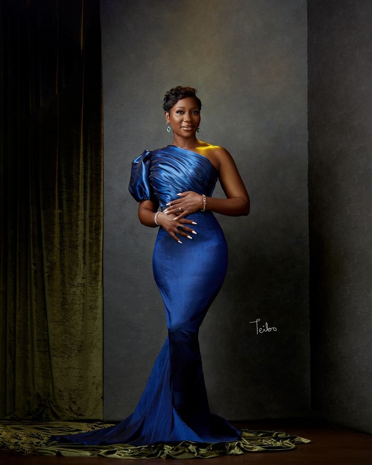 a painting of a woman in a blue dress