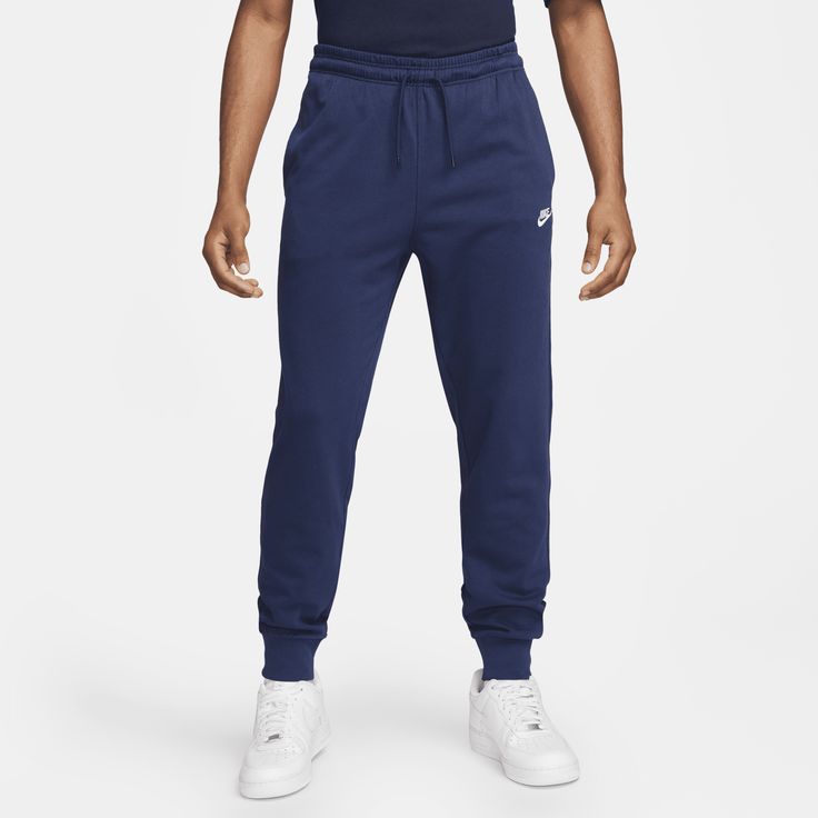 East to style and comfortable to wear, our Nike Club knit joggers are ready to become a versatile piece of your casual wardrobe. The relaxed fit is designed to give you a bit of room through the seat and thighs. The slight taper and ribbed ankle cuffs keep it clean around your sneakers. Pull them on with a tee or your favorite hoodie for casual, everyday wear. Nike Cotton Joggers, Nike Cotton Joggers For Leisure, Comfortable Nike Cotton Joggers, Comfortable Cotton Nike Joggers, Nike Cotton Joggers For Loungewear, Nike Comfortable Joggers For Loungewear, Nike Cotton Joggers With Relaxed Fit, Nike Casual Cotton Sweatpants, Nike Cotton Joggers With Comfort Waistband