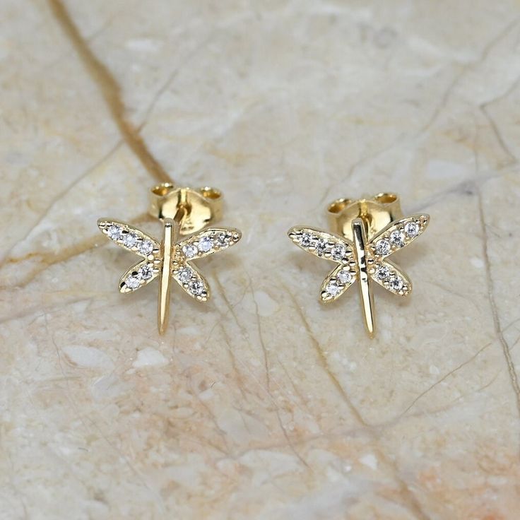 💙 Set of 2 real gold dainty earrings, fine jewelry for her.   💙 Our jewelry is handcrafted with love and great care at San Francisco Bay! All of our items are 14k stamped for authenticity. 💙 You will receive them exactly as pictured. We don't use any filters, all photos are authentic and unedited.  💙 The material is 14k solid gold, should not be confused with gold plating or filling. It won't tarnish or fade over time. 💙 We're offering the finest quality in solid gold jewelry. 💙 Quick ship Gold Cubic Zirconia Earrings As Gift, Gold Cubic Zirconia Diamond Earrings As Gift, Gold Cubic Zirconia Diamond Earrings For Gifts, Gold Plated Round Diamond Earrings As Gift, Yellow Gold Cubic Zirconia Earrings For Gift, Gold Diamond Earrings With Ear Wire, Gift Yellow Gold Diamond Earrings Hallmarked, Gold Sterling Silver Earrings With Prong Setting, Gold Plated Earrings With Prong Setting As Gift