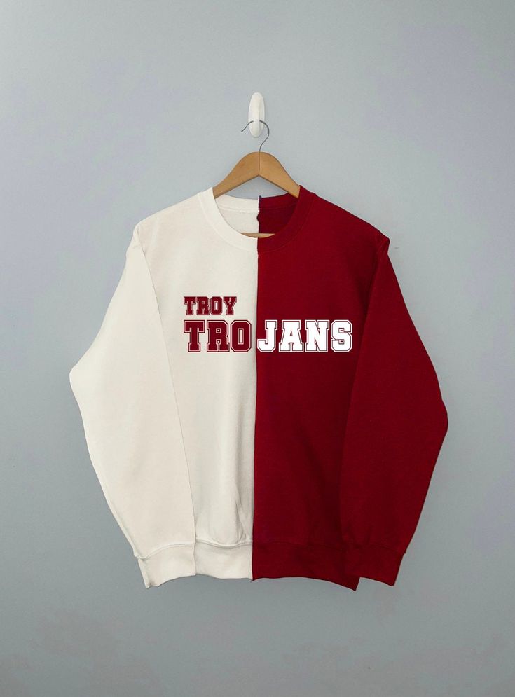 A duo red/white sweatshirt with Troy Trojans or wording. *3 WEEK TURNAROUND DUE TO HANDMADE ITEM *Sweatshirt colors maybe switched from above images White T-shirt With Ribbed Cuffs For College, White Long Sleeve Sweatshirt With School Spirit, White Oversized Sweatshirt With School Spirit, White College Style Tops With Ribbed Cuffs, White Oversized Sweatshirt For Sports Season, White Varsity Top With Ribbed Cuffs, White Long Sleeve Sweatshirt For College, White Long Sleeve College Sweatshirt, White School Spirit Sweatshirt With Ribbed Cuffs