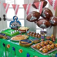 a football themed party with balloons and food