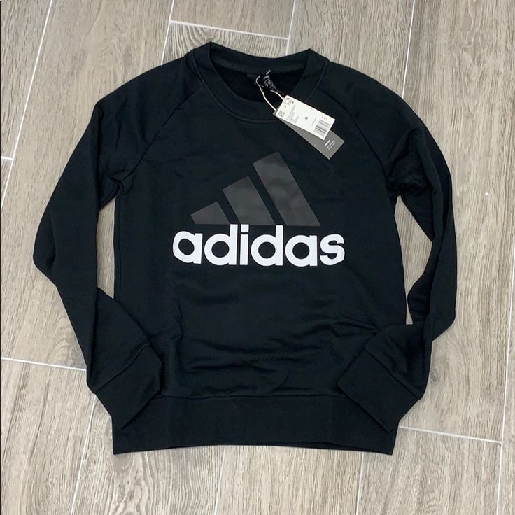 Nwt Adidas Women's Essential Crewneck Sweatshirt Adidas Tops With Letter Print For Sports Season, Adidas Sportswear Tops With Letter Print, Basic Black Sweatshirt With Graphic Print, Adidas Logo Fall Sportswear Top, Adidas Logo Sportswear Top For Fall, Adidas Black Letter Print Sweatshirt, Adidas White Sweatshirt With Letter Print, Adidas Cotton Sweatshirt With Logo Print, Adidas Black Sweatshirt For Sports Season