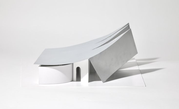 a white bench sitting on top of a white floor