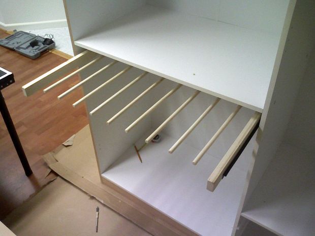 an unfinished shelf is being built into the wall in this room with wood flooring