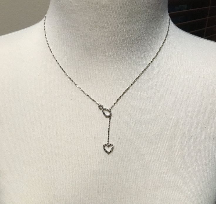 "Silver Drop Heart Necklace Mark - 925 Rhodium Plated Clear Stones 22\" from Back of neck to bottom of heart Spring Ring Clasp Petite  Condition - Like New" Adjustable Silver Heart Cut Necklace, Silver Open Heart Necklace With Adjustable Chain, Adjustable Sterling Silver Open Heart Necklace, Silver Heart-shaped Lariat Necklace With Adjustable Chain, 14k Gold Necklace, Silver Heart Necklace, Rhinestone Earrings, Buy Handmade, Gold Hoop