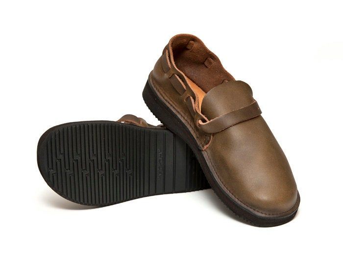 "Handmade in Aurora, New York. Tried and true, the Middle English is a monk style flat that is the very definition of comfort. The full grain, leather construction molds to your foot with wear, and the Vibram rubber sole lets you walk comfortably for miles. This simple style can be appropriate for any occasion. This is the trademark shoe that we have been producing for 20+ years. Our trademark adjustable strap weaves around the back of the heel and closes on a solid brass buckle. Available in 5 Casual Brown Monk Strap Shoes With Closed Toe, Casual Slip-on Monk Strap Shoes With Removable Insole, Casual Leather Monk Strap Shoes With Rubber Sole, Casual Slip-on Leather Monk Strap Shoes, Casual Leather Slip-on Monk Strap Shoes, Casual Brown Monk Strap Shoes With Leather Footbed, Casual Monk Strap Shoes With Leather Sole, Casual Brown Monk Strap Shoes With Leather Sole, Casual Brown Monk Strap Shoes With Round Toe