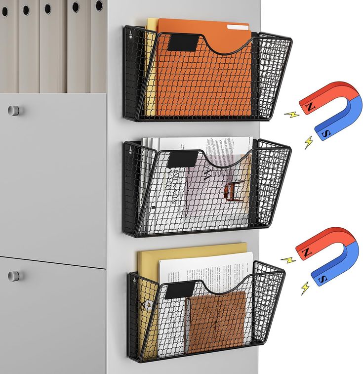 three bins are attached to the wall with magnets on them and each has a file folder in it