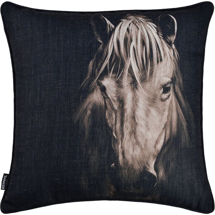 a black and white photo of a horse's head on a dark blue pillow